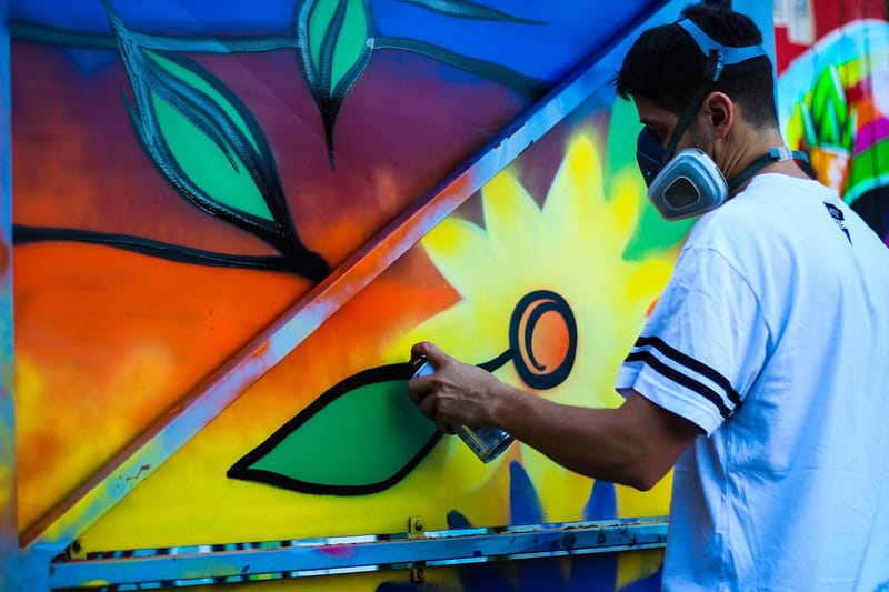 Artist spray painting flowers (Unsplash) jigsaw puzzle
